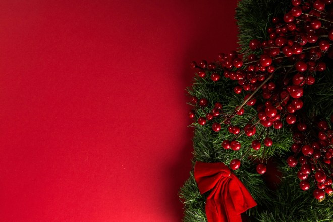 Faux holly on a red background.